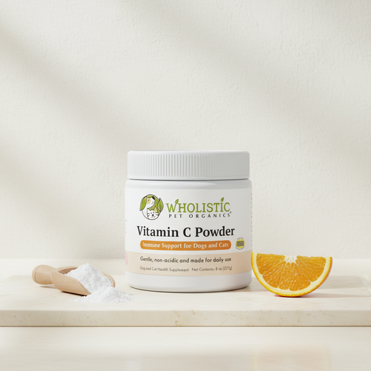 Wholistic Pet Organics Vitamin C Powder supplement for dogs and cats with fine white powder and a citrus accent.